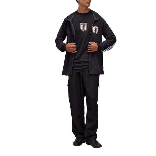 Men's Y-3 JFA Anthem Jacket in Black Mens Y-3 JFA Anthem Jacket in blackY-3 and the Japanese Football Association have collaborated to create unique on-pitch styles worn by JFA during the world's most iconic athletic event. The celebrated jacket that JFA players wear standing side-by-side on the pitch has now been elevated through a Y-3 lens. In collaboration with the Japanese Football Association the Y-3 JFA Anthem Jacket pairs classic sport design with Y-3's masterful eye for detail. The 3-Stripes are seen on one arm only and a JFA crest and Y-3 logo accent the look. AEROREADY manages moisture to keep you dry and feeling confident.This product is made with at least 70% recycled materials. By reusing materials that have already been created we help to reduce waste and our reliance on finite resources and reduce the footprint of the products we make.- A jacket from Y-3 and the Japanese Football Association made in part with recycled materials.- Relaxed fit- Zip front- 83% polyamide (recycled) 17% elastane- AEROREADY- Ribbed cuffs- Y-3 logo and Japan Football Association crest heat transfers- Zip front pockets- Contains at least 70% recycled content- Machine wash cold mild delicate cycle- Ref: IW7385