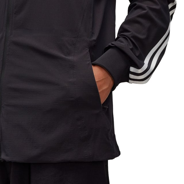 Men's Y-3 JFA Anthem Jacket in Black Mens Y-3 JFA Anthem Jacket in blackY-3 and the Japanese Football Association have collaborated to create unique on-pitch styles worn by JFA during the world's most iconic athletic event. The celebrated jacket that JFA players wear standing side-by-side on the pitch has now been elevated through a Y-3 lens. In collaboration with the Japanese Football Association the Y-3 JFA Anthem Jacket pairs classic sport design with Y-3's masterful eye for detail. The 3-Stripes are seen on one arm only and a JFA crest and Y-3 logo accent the look. AEROREADY manages moisture to keep you dry and feeling confident.This product is made with at least 70% recycled materials. By reusing materials that have already been created we help to reduce waste and our reliance on finite resources and reduce the footprint of the products we make.- A jacket from Y-3 and the Japanese Football Association made in part with recycled materials.- Relaxed fit- Zip front- 83% polyamide (recycled) 17% elastane- AEROREADY- Ribbed cuffs- Y-3 logo and Japan Football Association crest heat transfers- Zip front pockets- Contains at least 70% recycled content- Machine wash cold mild delicate cycle- Ref: IW7385