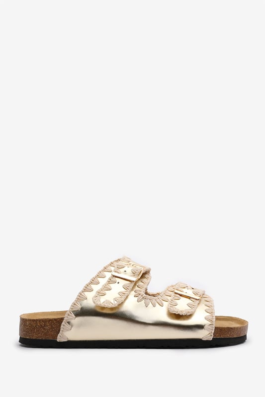 Wheres That From Womens 'Andi' Chunky Flatform Sandals With Cutout Straps Slide into effortless summer style with these Andi Chunky Flatform Sandals With Cutout Straps, crafted for comfort and standout design. Featuring bold contrast embroidery and dual adjustable buckle straps, they blend both charm with practicality. The cork-style footbed provides arch support, ideal for holidays, festivals, or casual city strolls. Key Features: • Material: Faux leather upper with a soft suede-effect footbed and cork midsole • Design: Dual-strap slide with decorative stitching and metallic buckles • Closure: Adjustable twin buckle straps for a secure and personalized fit