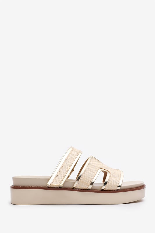 Wheres That From Womens 'Splendor' Slider Flatform Sandals With Cutout Straps Add a touch of glamour to your casual looks with these Splendor Slider Flatform Sandals With Cutout Straps. Featuring textured woven panels and metallic gold trims, they combine comfort and sophistication in one easy slide-on style. The cushioned footbed and elevated sole provide support with a fashionable edge. Perfect for day-to-night wear, holidays, or city strolls. Key Features: • Material: Woven textile and faux leather upper with padded insole • Design: Wide-cut slide with cut-out detailing and gold metallic trim • Closure: Slip-on style for ease and comfort