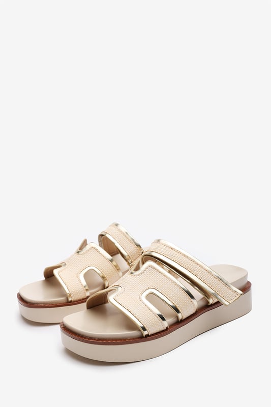 Wheres That From Womens 'Splendor' Slider Flatform Sandals With Cutout Straps Add a touch of glamour to your casual looks with these Splendor Slider Flatform Sandals With Cutout Straps. Featuring textured woven panels and metallic gold trims, they combine comfort and sophistication in one easy slide-on style. The cushioned footbed and elevated sole provide support with a fashionable edge. Perfect for day-to-night wear, holidays, or city strolls. Key Features: • Material: Woven textile and faux leather upper with padded insole • Design: Wide-cut slide with cut-out detailing and gold metallic trim • Closure: Slip-on style for ease and comfort