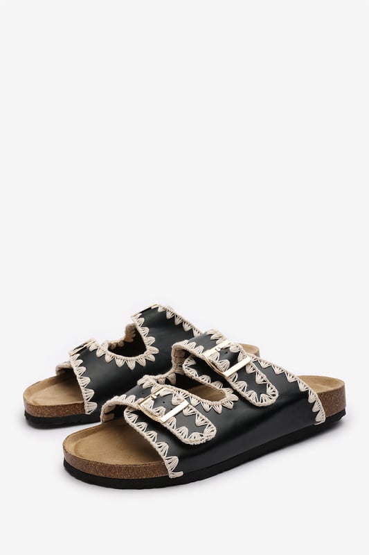 Slide into effortless summer style with these Andi Chunky Flatform Sandals With Cutout Straps, crafted for comfort and standout design. Featuring bold contrast embroidery and dual adjustable buckle straps, they blend both charm with practicality. The cork-style footbed provides arch support, ideal for holidays, festivals, or casual city strolls. Key Features: • Material: Faux leather upper with a soft suede-effect footbed and cork midsole • Design: Dual-strap slide with decorative stitching and metallic buckles • Closure: Adjustable twin buckle straps for a secure and personalized fit