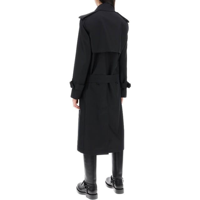 Gabardina de seda con mezcla de Burberry - Composición: 40% Poliéster 60% Seda - Forro: Viscosa - Mangas largas - Solapas de pico - Cierre con botones en la parte delantera - Cinturón a juego desmontable - Lavado a mano - Solapa delantera y protector de tormenta en la parte trasera - Dos bolsillos laterales - Abertura central en la espalda - Hecho en Italia - Género: W