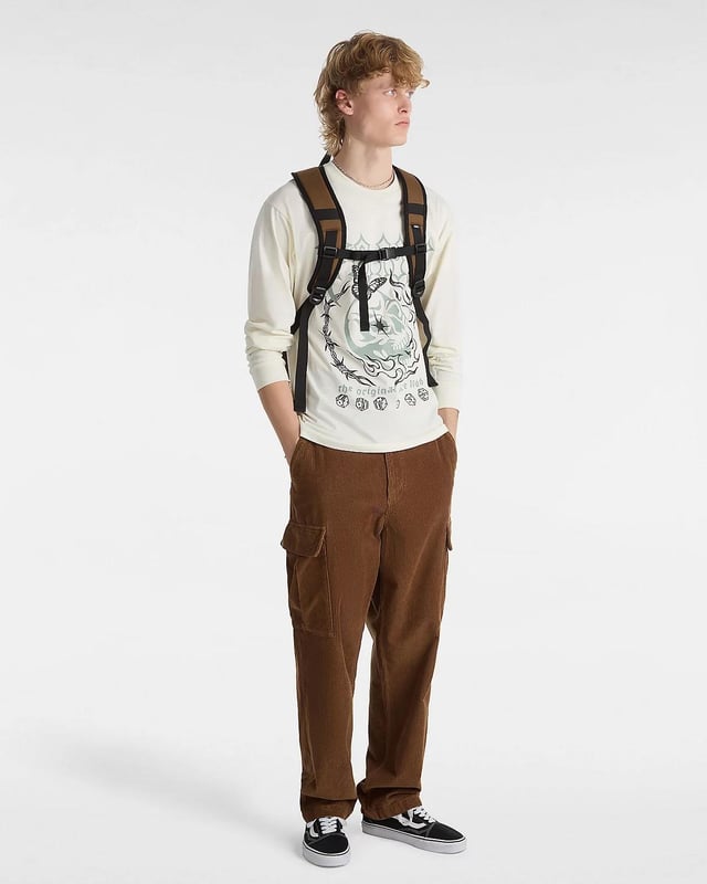 Add bold style to your everyday wardrobe with the Vans Lucky Streak Long Sleeve T-Shirt. Made from 100% soft cotton, this classic-fit tee features a crew neckline and eye-catching skeleton-inspired Vans logo artwork on the front. Designed for both comfort and edge, it’s perfect for adding a touch of statement graphics to your casual look. Key Features: Soft and breathable 100% cotton fabric Classic fit with a crew neckline Graphic Vans logo with skeleton imagery on the chest Long sleeves for versatile styling Style Code: VN000G4YFS8 Whether layered or worn on its own, this tee delivers signature Vans attitude with everyday comfort.