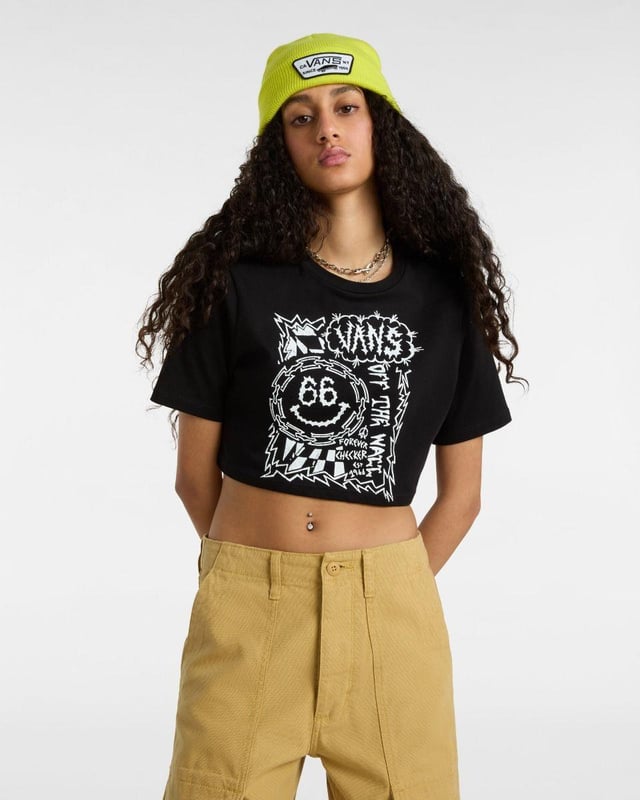 Add a playful edge to your casual wardrobe with the Vans Forever Checker T-Shirt. Made from soft 100% cotton, this short-sleeve tee features a classic crew neckline and eye-catching checkerboard-inspired graphic on the front. The cropped silhouette offers a trendy, laid-back vibe—perfect for pairing with high-waisted jeans, skirts, or shorts. Key Features: Soft and breathable 100% cotton fabric for all-day comfort Cropped length for a modern, youthful look Bold checkerboard-inspired graphic print on the front Classic crew neck and short sleeves for easy styling Ideal for everyday wear, from relaxed weekends to festival-ready fits A perfect blend of comfort and iconic Vans street style.