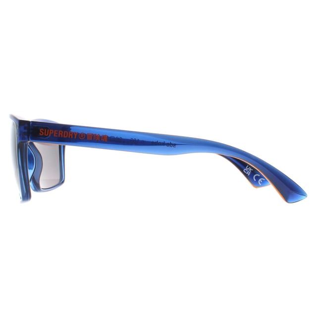 Superdry Square Mens Navy and Black Silver Mirror Kobe  Sunglasses are a perfect combination of sporty and stylish design. The temples of the glasses feature the iconic Superdry logo, adding a touch of designer flair. These sunglasses are perfect for those who want to add a sporty edge to their look and are versatile enough to pair with any outfit, whether you're dressing up or down.