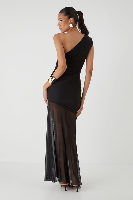 Striking one-shoulder design with elegant ruched detailing
        Figure-flattering jersey fabric with strategic ruching across the bodice
        Dramatic maxi length with sheer mesh overlay from mid-thigh
        Body-contouring silhouette that accentuates your curves
        Lined construction for comfort and coverage where needed
    
    Make a showstopping entrance in this captivating mesh ruched one-shoulder maxi dress from MissPap. The asymmetric neckline creates a bold statement whilst the expertly placed ruching works to flatter your figure. The dress transitions beautifully from a fitted bodice to a flowing sheer mesh skirt, creating a tantalising glimpse of leg whilst maintaining an air of sophistication. Style with strappy heels and statement jewellery as seen on our model for formal occasions such as weddings or galas. For evening events, add a structured clutch and sleek updo to highlight the dramatic neckline. This dress commands attention whilst offering versatility - a true wardrobe hero piece for those moments when you want all eyes on you.