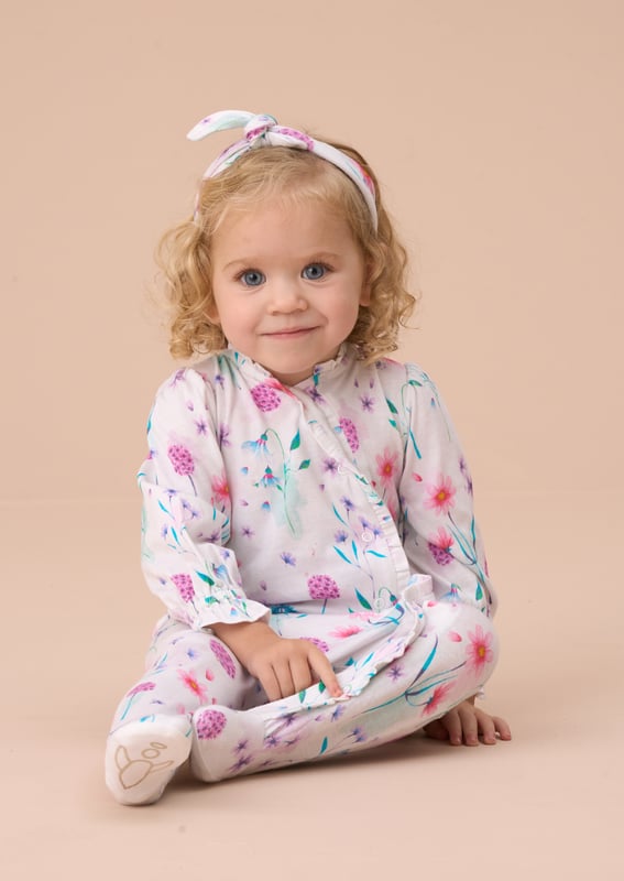 Bloomin' cute! This charming floral print babygrow with soft gathered cuffs and matching headband is the perfect pick for your little bud to blossom in comfort and style.