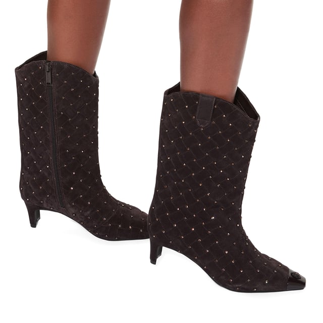 This Kurt Geiger Regent Ankle Boot features a dark brown upper with a black toe cap. There is a black eagle head with pink crystals on top of the toe all sat on a fashionable kitten block heel. Heel height: 5.5cm.