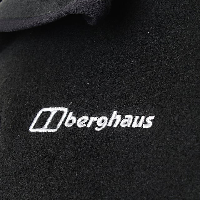 Main: 100% Polyester. This fleece is perfect for chilly days, serving as an extra layer under a jacket or cozy on its own. It features a zipped chest pocket and two hand pockets for convenience.