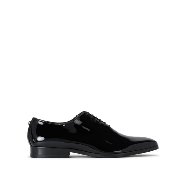 This Logan Oxford is a formal shoe crafted from a black patent leather. Built on a custom designed KGL last for a classic formal look with a modern twist. These shoes can be re-soled to extend their lifespan even further.