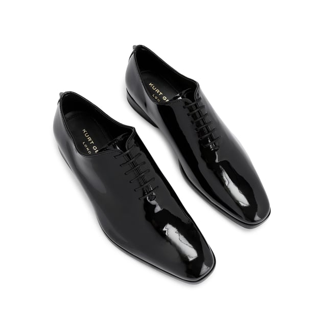 This Logan Oxford is a formal shoe crafted from a black patent leather. Built on a custom designed KGL last for a classic formal look with a modern twist. These shoes can be re-soled to extend their lifespan even further.