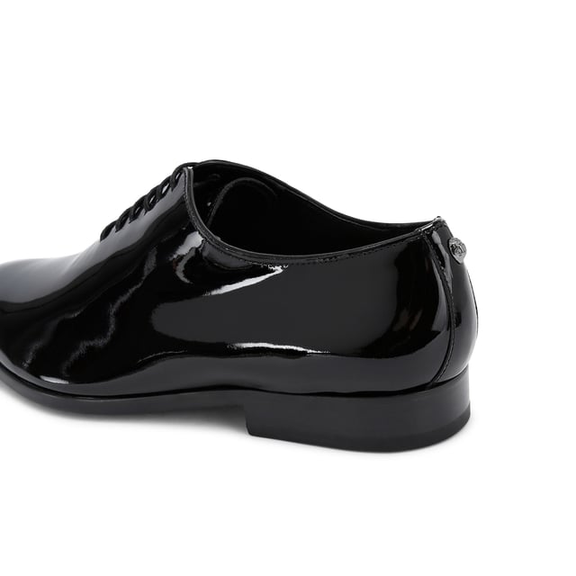 This Logan Oxford is a formal shoe crafted from a black patent leather. Built on a custom designed KGL last for a classic formal look with a modern twist. These shoes can be re-soled to extend their lifespan even further.