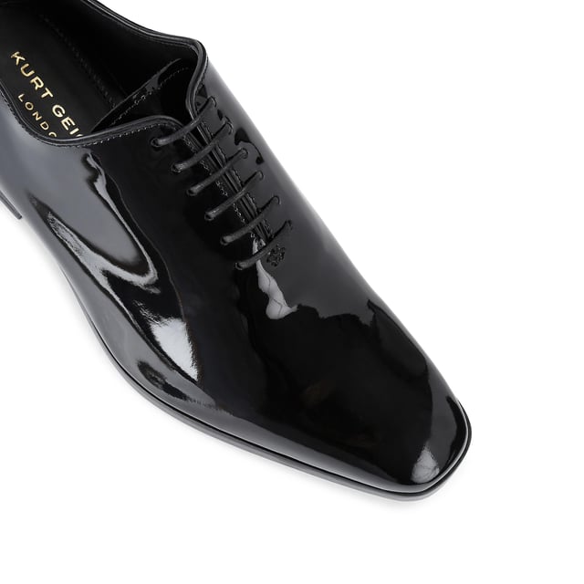 This Logan Oxford is a formal shoe crafted from a black patent leather. Built on a custom designed KGL last for a classic formal look with a modern twist. These shoes can be re-soled to extend their lifespan even further.