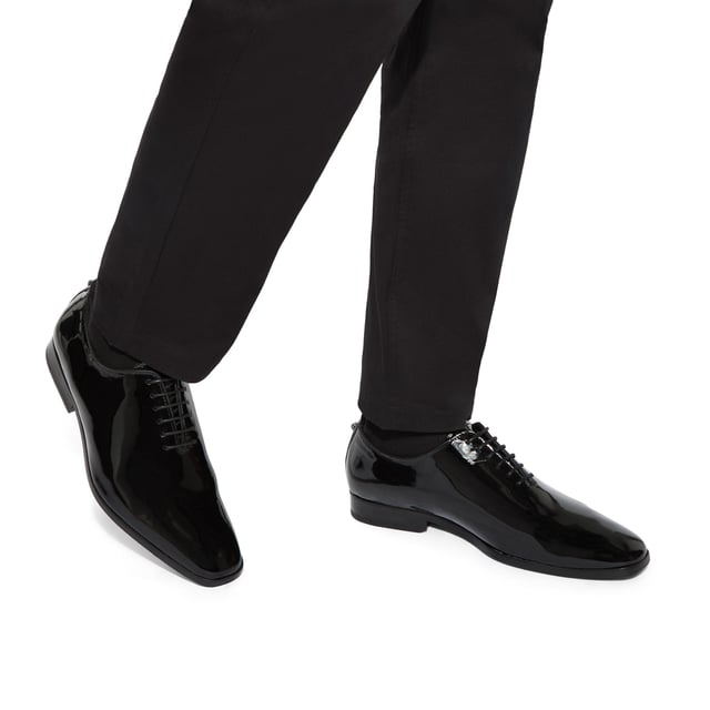 This Logan Oxford is a formal shoe crafted from a black patent leather. Built on a custom designed KGL last for a classic formal look with a modern twist. These shoes can be re-soled to extend their lifespan even further.