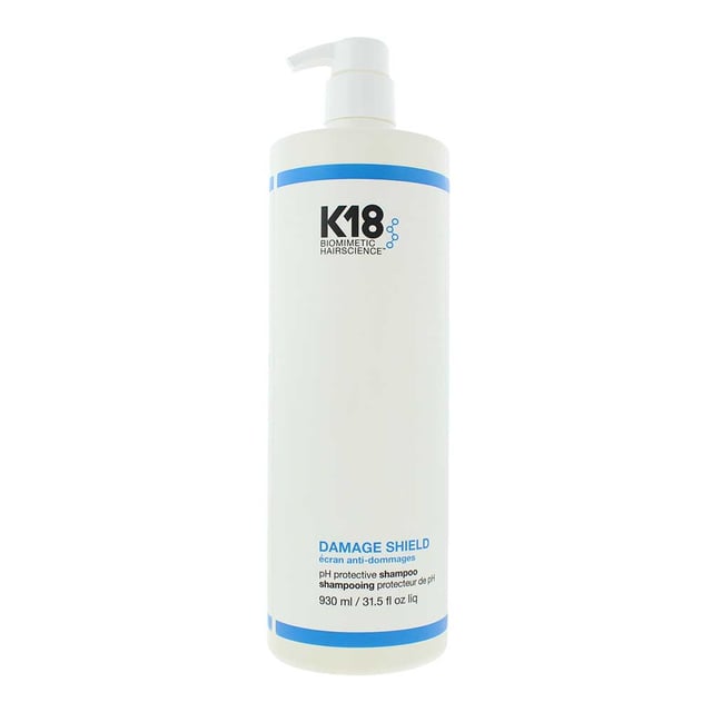 K18 Damage Shield pH Protective Shampoo 930ml K18 Damage Shield pH Protective Shampoo is a color-safe, pH-optimized shampoo designed to gently cleanse while protecting hair from damage caused by environmental stressors, styling, and chemical treatments. This science-backed formula helps maintain the hair’s natural moisture balance and cuticle health by working within the ideal pH range (4.5–5.5), minimising swelling of the hair shaft and preserving strength and color vibrancy.
Key Benefits
pH-balanced to protect the hair fibre and maintain scalp health
Gently removes dirt, excess oil, and product build-up without stripping
Helps preserve colour, keratin treatments, and the integrity of chemically treated hair
Strengthens hair and reduces damage over time when used consistently
Safe for daily use and suitable for all hair types
Free From
Sulfates
Parabens
Silicones
Colorants
Heavy waxes or fillers
How to Apply
Wet hair thoroughly. Apply a small amount of K18 Damage Shield Shampoo to the scalp and roots.
Massage gently with fingertips to lather, working the product through the hair.
Rinse thoroughly.
Pro Tip: For best protection, use consistently—especially before and after chemical treatments, heat styling, or exposure to environmental stress like sun, salt, or pollution.