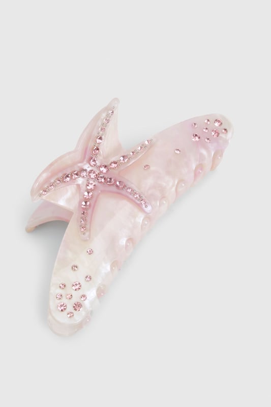 Striking starfish design with sparkling diamante embellishments
        Secure claw clip mechanism for effortless styling
        Textured detailing mimicking natural starfish features
        Generous size perfect for securing medium to thick hair
        Versatile accessory that adds a touch of coastal charm to any look
    
    Transform your tresses with this eye-catching diamante starfish claw clip from Boohoo. The perfect companion for beach days and summer getaways, this statement hair accessory brings coastal vibes to your everyday style. Secure half-up styles with ease or twist your hair into a casual updo for instant seaside sophistication. The sparkling diamante details catch the light beautifully, adding a subtle shimmer to your look whether you're lounging by the pool or enjoying sunset cocktails. Pair with flowing maxi dresses and sandals for daytime beach club chic, or use to accent loose waves for evening resort dining. This versatile clip works wonderfully with both casual and dressed-up holiday ensembles, making it an essential addition to your summer accessories collection.