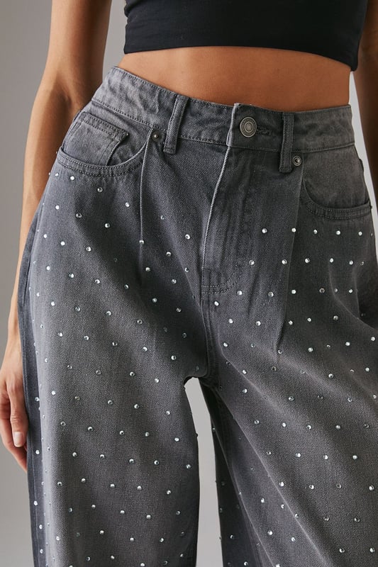 Relaxed boyfriend fit with a contemporary wide-leg silhouette
        Striking hotfix embellishments scattered across the denim for added sparkle
        Classic five-pocket design with functional front and back pockets
        High-rise waistband for a flattering and comfortable fit
        Traditional button and zip fastening for secure wear
    
    Make a statement with these Warehouse Hotfix Embellished Denim Boyfriend Jeans, where casual comfort meets eye-catching style. The relaxed boyfriend fit offers effortless wearability whilst the scattered embellishments add a touch of glamour to everyday denim. Style with a simple crop top and trainers for daytime outings, as seen on our model, or dress up with a fitted bodysuit and heeled boots for evening drinks. These versatile jeans transition seamlessly from family gatherings to casual brunches with friends. The high-rise waistband creates a flattering silhouette that works brilliantly with both tucked-in tops and shorter lengths. A true wardrobe hero that combines the timeless appeal of denim with contemporary detailing for the confident Warehouse woman.