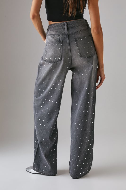 Relaxed boyfriend fit with a contemporary wide-leg silhouette
        Striking hotfix embellishments scattered across the denim for added sparkle
        Classic five-pocket design with functional front and back pockets
        High-rise waistband for a flattering and comfortable fit
        Traditional button and zip fastening for secure wear
    
    Make a statement with these Warehouse Hotfix Embellished Denim Boyfriend Jeans, where casual comfort meets eye-catching style. The relaxed boyfriend fit offers effortless wearability whilst the scattered embellishments add a touch of glamour to everyday denim. Style with a simple crop top and trainers for daytime outings, as seen on our model, or dress up with a fitted bodysuit and heeled boots for evening drinks. These versatile jeans transition seamlessly from family gatherings to casual brunches with friends. The high-rise waistband creates a flattering silhouette that works brilliantly with both tucked-in tops and shorter lengths. A true wardrobe hero that combines the timeless appeal of denim with contemporary detailing for the confident Warehouse woman.