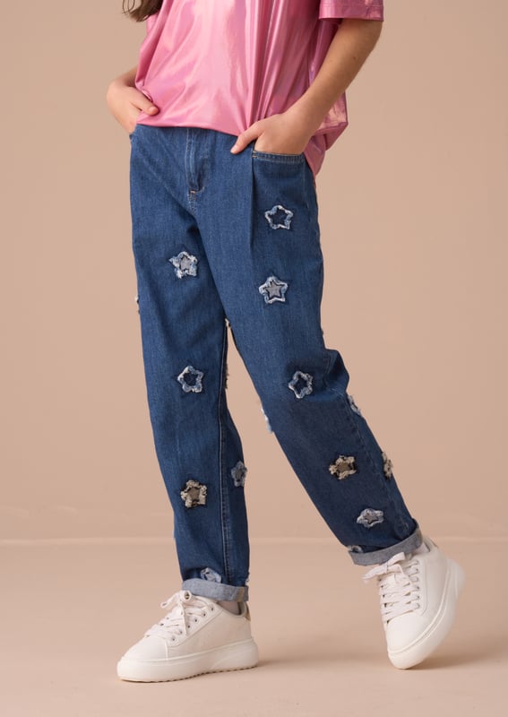 Our new barrel fit jean is a fabulous addition to any wardrobe. Crafted from classic   denim in a fashion-forward cut and scattered with applique stars. Dress up or down but always shine!.