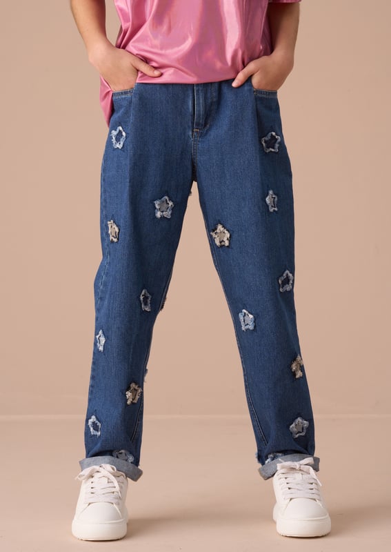 Our new barrel fit jean is a fabulous addition to any wardrobe. Crafted from classic   denim in a fashion-forward cut and scattered with applique stars. Dress up or down but always shine!.