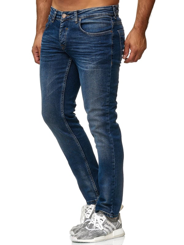 Tazzio Herren Jeans Slim Fit •Moderne & zeitlose Herren Jeans von Tazzio
•Verschluss: Knopfverschluss (verdeckter Zip Fly)
•Hosentaschen: Eingrifftaschen, Coinpocket, Gesäßtaschen
•Stretchanteil für eine optimale Passform
•Gürtelschlaufen
•Hochwertiges Material & bequem zu tragen
•Ideale Jeans das ganze Jahr
Passform
•Passform: Slim Fit
•Länge: Lang
•Leibhöhe: normal
Material & Pflege
•Material Oberstoff: 97% Baumwolle, 3% Elasthan
•Materialkonstruktion: Denim/Jeans
•Elastizität: Leicht elastisch
•Pflegehinweise: Maschinenwäsche
