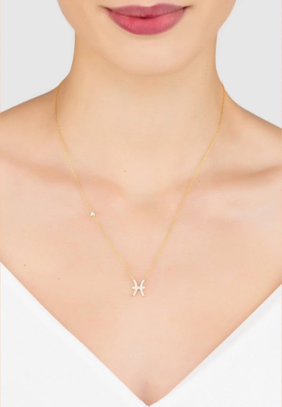 Design:Made of 925 sterling silver, dipped in 22ct gold. This necklace is hand set with multifaceted white zircons.Pisces celebrate birthdays February 19 - March 20Finished with a lobster clasp, and size adjusterDimensions: Necklace can be worn 40cm chain length or 45cm chain length using adjuster. Motif 1.5cm x 1cmPackaging:This item is presented in a Latelita London signature packagingCare Instructions:To maintain your jewellery, wipe gently with a damp cloth that is soft and clean. Do not soak in water. Avoid contact with soaps, detergents, perfume or hair spray.