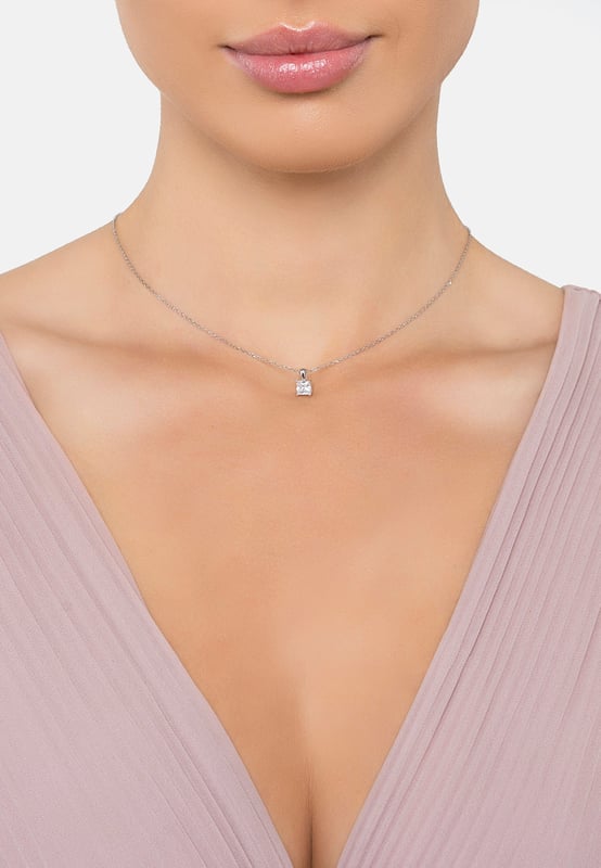 This is the pendant you’ll reach for again and again. The Ever After Solitaire Pendant Necklace feels like a timeless addition to your collection, crafted from sleek 925 sterling silver for a polished finish that catches the light just right.The square cubic zirconia, measuring 0.5 x 0.5 cm, adds just the right amount of sparkle, subtle yet undeniable. Set on a 39-42 cm adjustable chain, it sits perfectly, with a highly polished silver bail that enhances its refined simplicity.At just 1.3 grams, it's light enough for everyday wear, but the elegance it brings will make you feel special no matter the occasion.