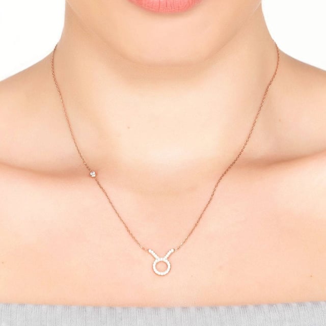 Embrace the wonders of the universe with our Zodiac Star Sign Pendant Necklace Silver! This piece is perfect for those looking to add a hint of timeless, celestial charm to any look.At the heart of this jewellery design lies its centrepiece, a stunning motif hand set with multifaceted white zircons in the design of your zodiac sign symbol.Those born under the sign of Taurus are known to be tenacious, reliable and practical. They don't like taking risks and instead prefer to take a steady approach to life. With their birthdays ranging from April 20th to May 20th, Taurians are also known for their love of comfort and luxury in all aspects of life.This necklace is finished off with a lobster clasp and size adjuster allowing you to wear at either a 40cm or 45cm chain length! Lightweight, weighing just 2.6 grams, it is made of 925 sterling silver and is perfect for accessorizing any ensemble - from casual to formal.With its unparalleled craftsmanship, this captivating piece exudes effortless style and charm, making it a truly remarkable accessory. Get yours now and show off the fashionista inside you.