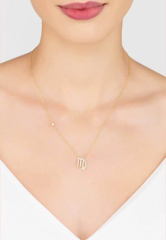Zodiac Star Sign Pendant Necklace Gold Virgo Made of 925 sterling silver, dipped in 22ct gold. This necklace is hand set with multifaceted white zircons.Virgos celebrate birthdays August 23 - September 22Finished with a lobster clasp, and size adjuster.Dimensions: Necklace can be worn 40cm chain length or 45cm chain length using adjuster. Motif 1.5cm x 1cmPackaging:This item is presented in a Latelita London signature packagingCare Instructions:To maintain your jewellery, wipe gently with a damp cloth that is soft and clean. Do not soak in water. Avoid contact with soaps, detergents, perfume or hair spray.