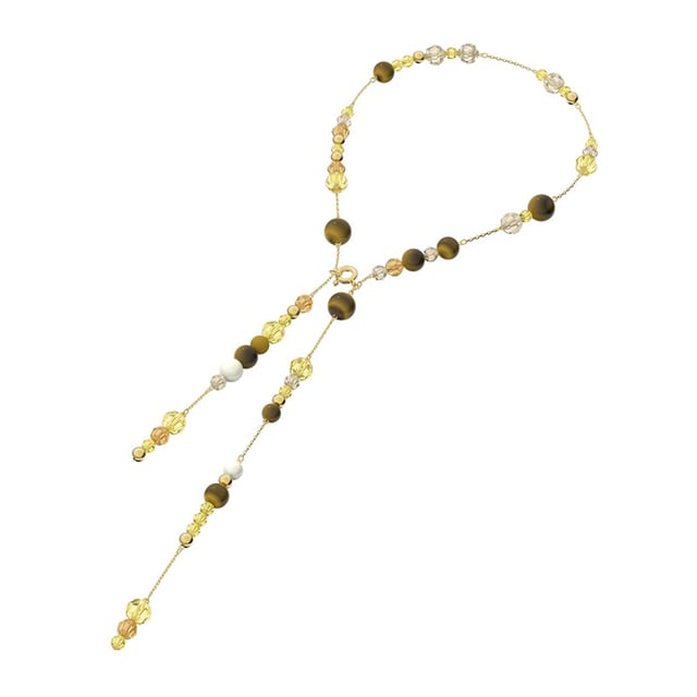 El collar Swarovski Somnia es una pieza de joyería excepcional que combina elegancia elegante y estilo boho chic moderno.\nCon su armoniosa mezcla de ojo de tigre, nácar y cristales en tonos tierra neutros, engastados en una capa de aleación de oro, este collar agregará un brillo especial a cualquier conjunto.\nPerfecto para superponer o como elemento destacado, este collar hace que cada conjunto sea único y radiante.\nJoya con baño de oro y cristales multicolores. Este collar está firmado por la directora creativa Giovanna Engelbert para la Colección II.\n Medidas: Longitud: 47cm\n Composición: Material: Cristales Swarovski, ojo de tigre, capa de aleación de oro.\n Cuidados:\nEvite el contacto con cremas, perfumes y detergentes que puedan dañar el producto. Para mantener el brillo, le recomendamos limpiarlo solo con un paño suave.