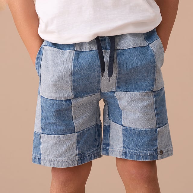Our light and medium denim patchwork design adds a playful look to the classic denim shorts creating a unique addition to their wardrobe. Wear with anything from polos to tees. A summer style essential!.