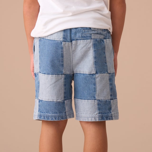 Our light and medium denim patchwork design adds a playful look to the classic denim shorts creating a unique addition to their wardrobe. Wear with anything from polos to tees. A summer style essential!.