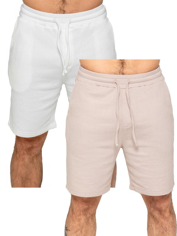 Experience ultimate comfort and style with our textured shorts. The elasticated waistband allows for a perfect fit with an adjustable drawstring. Convenient side pockets add functionality. Made with premium fabric for a luxurious feel. Pack of 2. (13)