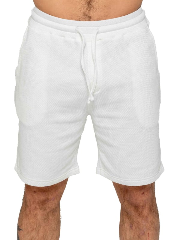 Experience ultimate comfort and style with our textured shorts. The elasticated waistband allows for a perfect fit with an adjustable drawstring. Convenient side pockets add functionality. Made with premium fabric for a luxurious feel. Pack of 2. (13)
