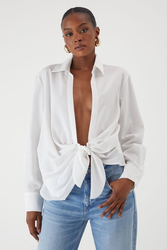 Linen Look Tie Side Oversized Shirt Oversized fit with distinctive side tie detail for versatile styling options
Textured linen-look fabric offering a relaxed yet polished appearance
Classic collar design with full-length sleeves for timeless appeal
Coordinating shorts create a chic co-ord set perfect for warm-weather occasions
Relaxed silhouette allows for effortless movement and comfort
This linen-look shirt from MissPap delivers effortless style with its contemporary oversized fit and distinctive side tie detail. The versatile piece can be styled multiple ways - wear it tied at the front with the matching shorts for a coordinated daytime look, or leave it unbuttoned over a crop top and denim shorts for casual gatherings. For a touch of glamour, pair with slim-fit trousers and strappy heels. The textured fabric creates a breezy, summery vibe that's ideal for family barbecues, brunches with the girls, or seaside holidays. Complete the ensemble with statement sunglasses and minimal jewellery for a look that's both relaxed and fashion-forward. The shirt's adaptable nature makes it a wardrobe essential that transitions seamlessly from day to evening, simply by changing your accessories and footwear.