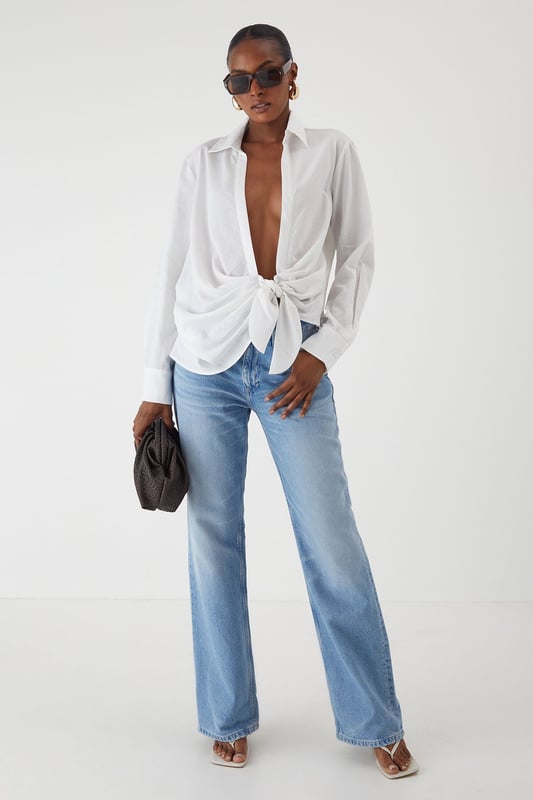 Linen Look Tie Side Oversized Shirt Oversized fit with distinctive side tie detail for versatile styling options
Textured linen-look fabric offering a relaxed yet polished appearance
Classic collar design with full-length sleeves for timeless appeal
Coordinating shorts create a chic co-ord set perfect for warm-weather occasions
Relaxed silhouette allows for effortless movement and comfort
This linen-look shirt from MissPap delivers effortless style with its contemporary oversized fit and distinctive side tie detail. The versatile piece can be styled multiple ways - wear it tied at the front with the matching shorts for a coordinated daytime look, or leave it unbuttoned over a crop top and denim shorts for casual gatherings. For a touch of glamour, pair with slim-fit trousers and strappy heels. The textured fabric creates a breezy, summery vibe that's ideal for family barbecues, brunches with the girls, or seaside holidays. Complete the ensemble with statement sunglasses and minimal jewellery for a look that's both relaxed and fashion-forward. The shirt's adaptable nature makes it a wardrobe essential that transitions seamlessly from day to evening, simply by changing your accessories and footwear.