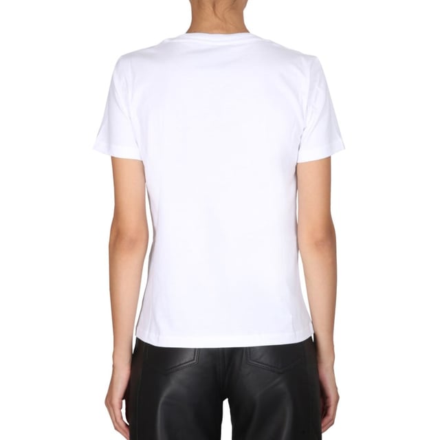 Elevate your casual wardrobe with the Moschino Double Smiley White T-Shirt, a playful yet stylish piece that effortlessly blends comfort and iconic design. Crafted from soft, breathable fabric, this t-shirt ensures all-day comfort while showcasing Moschino's signature bold double smiley graphic. Its crisp white color makes it a versatile staple, perfect for pairing with jeans or layering under jackets. Whether you're heading out for a relaxed day or making a statement with your streetwear, this t-shirt adds a fun, contemporary edge to your look. Embrace effortless style with a touch of Moschino's unique charm. Made in Portugal, 100% Cotton