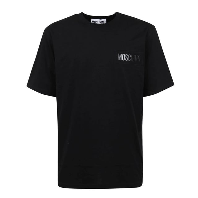 Moschino Logo Patch Black T-shirt Elevate your casual wardrobe with the Moschino Black T-Shirt, featuring the iconic Moschino logo patch for a bold, stylish statement. Crafted from high-quality fabric, this t-shirt offers exceptional comfort and durability, making it perfect for everyday wear. Its sleek black design pairs effortlessly with any outfit, while the distinctive logo patch adds a touch of luxury and modern flair. Ideal for those who appreciate fashion-forward pieces that combine comfort with standout style, this t-shirt is a must-have addition to your collection. Make a confident impression wherever you go with this signature Moschino piece. Made in Portugal, 100% Cotton