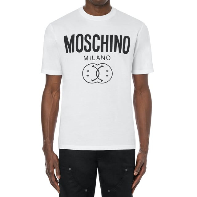 Elevate your casual wardrobe with the Moschino Milano Double Smiley Logo White T-Shirt. Crafted from premium, soft cotton, this tee offers exceptional comfort and breathability for all-day wear. Its crisp white fabric serves as the perfect backdrop for the iconic double smiley logo, making a bold, playful statement that captures Moschino's signature style. Whether paired with jeans or layered under a jacket, this versatile t-shirt adds a fresh, contemporary edge to any outfit. Embrace effortless fashion with a piece that combines quality, comfort, and standout design. Made in Portugal, 100% Cotton