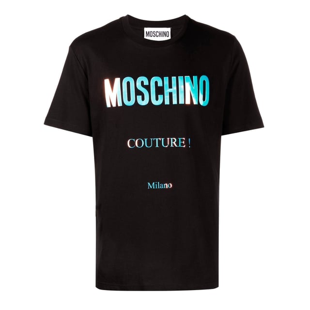 Moschino Couture Milano Reflective Logo Black T-shirt Elevate your wardrobe with the Moschino Couture Milano Reflective Logo Black T-Shirt, a perfect blend of luxury and street style. Crafted with premium materials, this sleek black tee features a striking reflective logo that catches the light, adding a bold, modern edge to your look. Ideal for day-to-night wear, it offers both comfort and standout style, making it a versatile addition to any fashion-forward collection. Experience the iconic Moschino quality and make a confident statement wherever you go. Made in Portugal, 100% Cotton