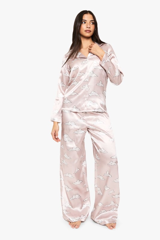 Cloud Print Satin Long Sleeve Shirt & Trousers Pyjama Set Take nights in up a notch with our silky soft sleepwearYou'll be saying no to nights out when you see our snuggle-worthy sleepwear and luxe loungewear. Cosy up in a co-ordinating pyjama set, drift off in a night dress or go for slumber party success in a statement onesie. Catch your beauty sleep in the best basics from boohoo.