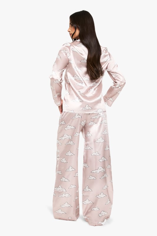 Cloud Print Satin Long Sleeve Shirt & Trousers Pyjama Set Take nights in up a notch with our silky soft sleepwearYou'll be saying no to nights out when you see our snuggle-worthy sleepwear and luxe loungewear. Cosy up in a co-ordinating pyjama set, drift off in a night dress or go for slumber party success in a statement onesie. Catch your beauty sleep in the best basics from boohoo.