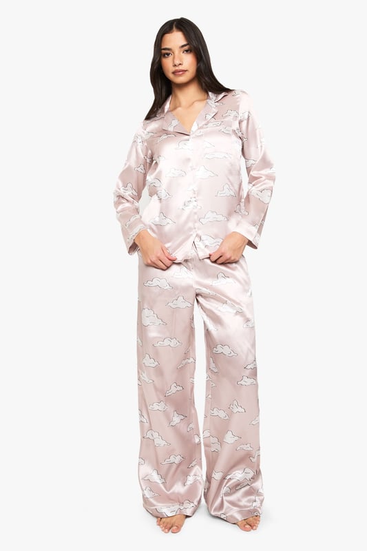 Cloud Print Satin Long Sleeve Shirt & Trousers Pyjama Set Take nights in up a notch with our silky soft sleepwearYou'll be saying no to nights out when you see our snuggle-worthy sleepwear and luxe loungewear. Cosy up in a co-ordinating pyjama set, drift off in a night dress or go for slumber party success in a statement onesie. Catch your beauty sleep in the best basics from boohoo.