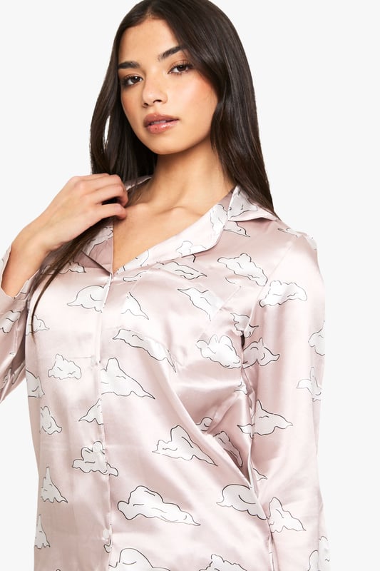 Cloud Print Satin Long Sleeve Shirt & Trousers Pyjama Set Take nights in up a notch with our silky soft sleepwearYou'll be saying no to nights out when you see our snuggle-worthy sleepwear and luxe loungewear. Cosy up in a co-ordinating pyjama set, drift off in a night dress or go for slumber party success in a statement onesie. Catch your beauty sleep in the best basics from boohoo.