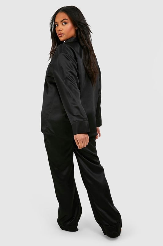 Luxurious satin fabric for ultimate comfort
        Stylish diamante detailing adds a touch of glamour
        Relaxed-fit trousers for unrestricted movement
        Button-up shirt with long sleeves for versatile wear
        Chic embroidered 'Love' detail on the chest pocket
    
    Indulge in the perfect blend of comfort and style with this satin diamante detail pyjama trouser set. The smooth, lustrous fabric caresses your skin, ensuring a restful night's sleep. The relaxed-fit trousers allow for easy movement, while the long-sleeved button-up shirt offers versatility for those lazy weekend mornings. The subtle diamante embellishments add a touch of sparkle, making you feel fabulous even in your downtime. Whether you're settling in for a cosy night or enjoying a leisurely breakfast in bed, this set strikes the ideal balance between relaxation and sophistication. Pair with soft slippers and a plush dressing gown for the ultimate loungewear ensemble, or wear the shirt with your favourite jeans for a chic, off-duty look that transitions seamlessly from night to day.