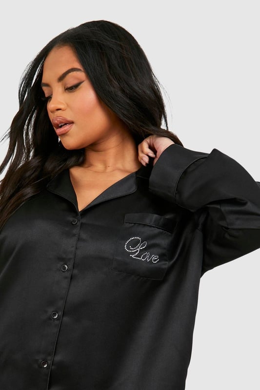 Luxurious satin fabric for ultimate comfort
        Stylish diamante detailing adds a touch of glamour
        Relaxed-fit trousers for unrestricted movement
        Button-up shirt with long sleeves for versatile wear
        Chic embroidered 'Love' detail on the chest pocket
    
    Indulge in the perfect blend of comfort and style with this satin diamante detail pyjama trouser set. The smooth, lustrous fabric caresses your skin, ensuring a restful night's sleep. The relaxed-fit trousers allow for easy movement, while the long-sleeved button-up shirt offers versatility for those lazy weekend mornings. The subtle diamante embellishments add a touch of sparkle, making you feel fabulous even in your downtime. Whether you're settling in for a cosy night or enjoying a leisurely breakfast in bed, this set strikes the ideal balance between relaxation and sophistication. Pair with soft slippers and a plush dressing gown for the ultimate loungewear ensemble, or wear the shirt with your favourite jeans for a chic, off-duty look that transitions seamlessly from night to day.