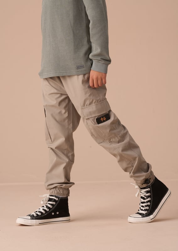 Introducing our new tech cargo jogger. a perfect wardrobe update. Cut to a relaxed fit with pockets at the side and elasticated drawstring waist and cuff. These joggers have you covered for any adventure!.