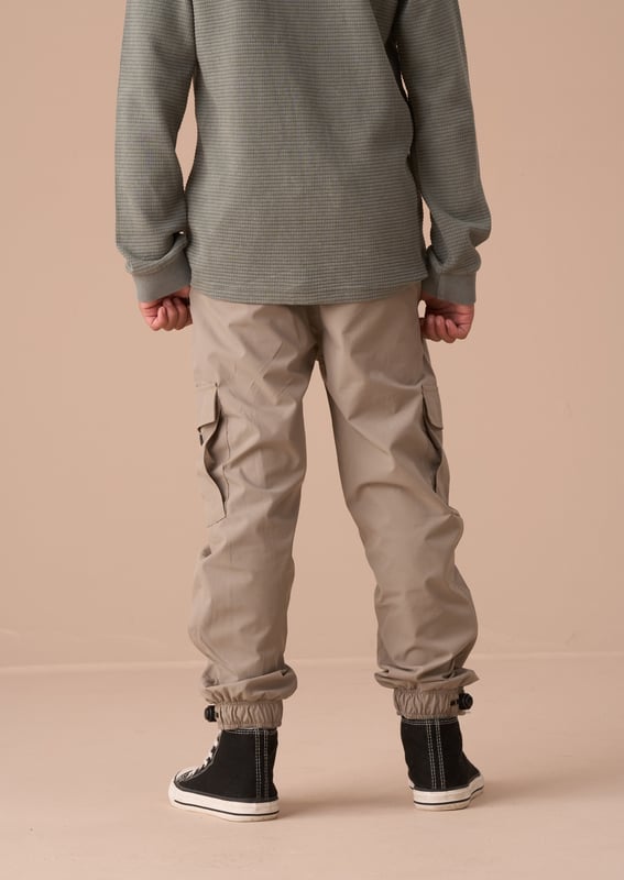 Introducing our new tech cargo jogger. a perfect wardrobe update. Cut to a relaxed fit with pockets at the side and elasticated drawstring waist and cuff. These joggers have you covered for any adventure!.