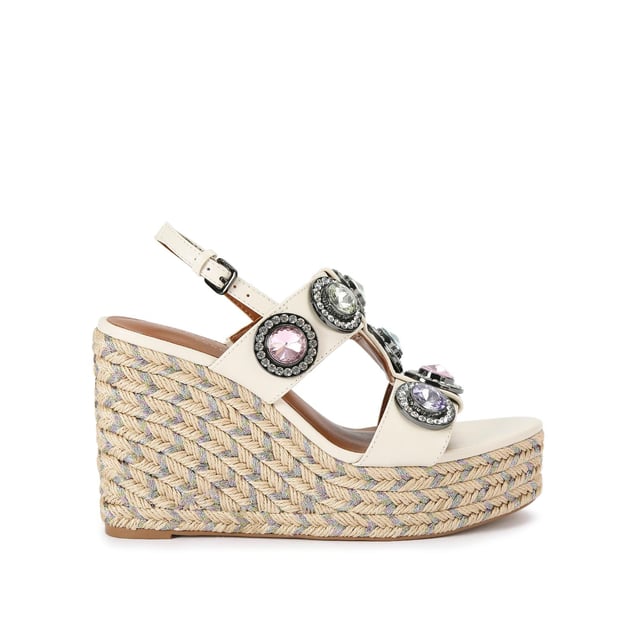 The Octavia Espadrille Wedge heel features a bone leather upper with large pastel crystals across the cage style upper. There is a rope effect to the wedge heel with pastel metallic thread running through. Heel height: 10.5cm.